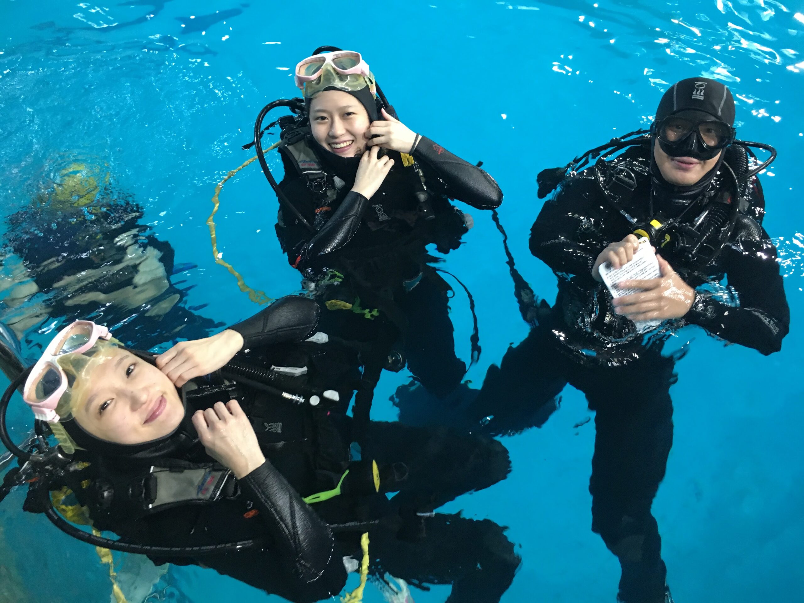 Beginner scuba diving lesson in a training pool in Seoul, Korea with an NB Divers instructor